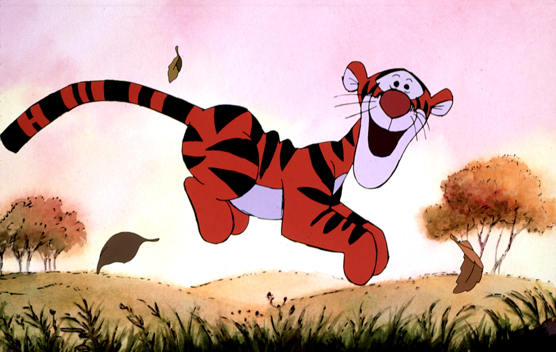 Animated tiger character Tigger is joyfully bouncing outdoors with leaves around