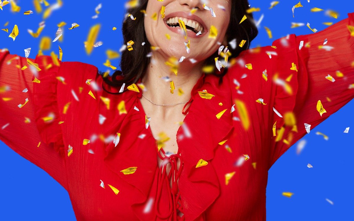 A woman celebrates winning the lottery