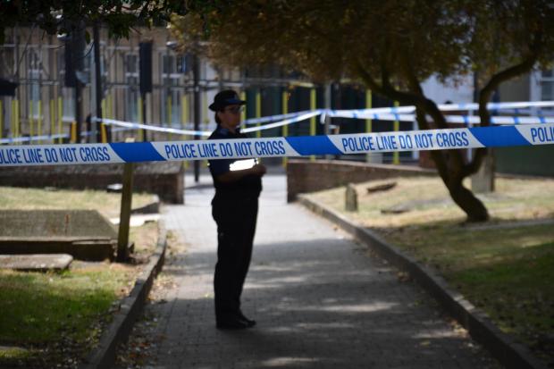 Pictures show forensics and police investigate attempted murder