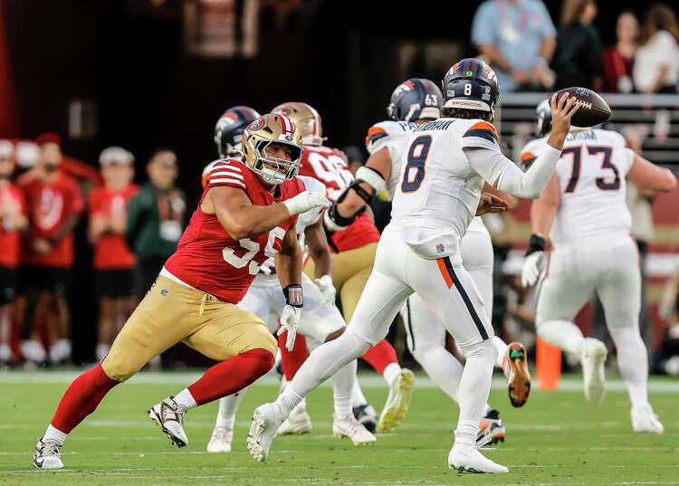 Sebastian Valdez (55) pressures Denver's Jarrett Stidham (8) in the second half as the San Francisco 49ers played the Denver Broncos at Levi's Stadium in Santa Clara, Calif., on Saturday, Aug. 9, 2025. (Carlos Avila Gonzalez/S.F. Chronicle)