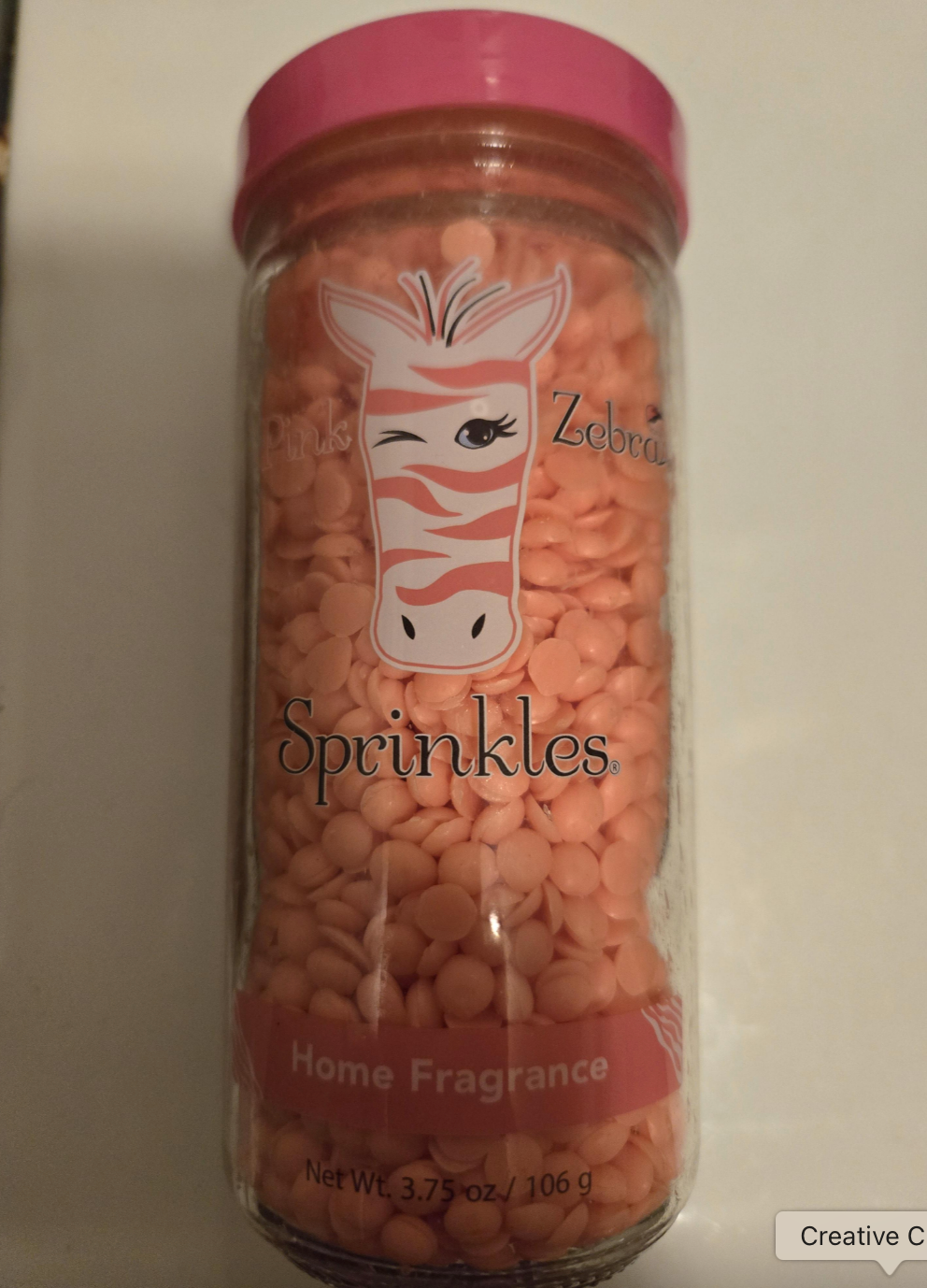 Jar of pink Zebra Sprinkles for home fragrance, featuring a winking zebra illustration on the label. Contains 3.75 oz