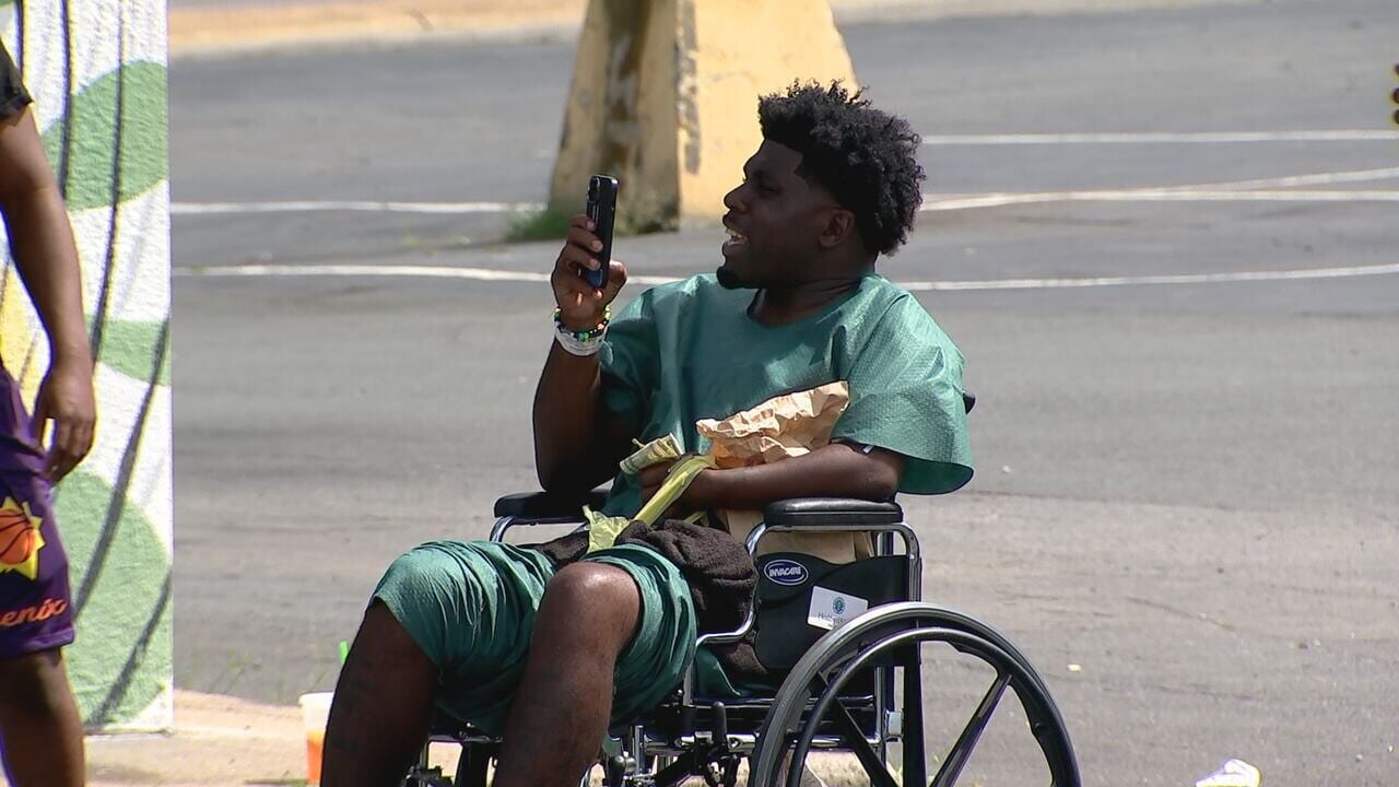 Rapper sponsors community event, returns to scene where he says he got shot