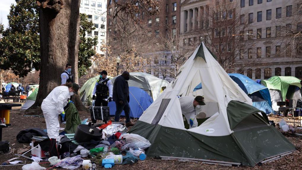 A tent encampment being removed from downtown Washington DC in 2023