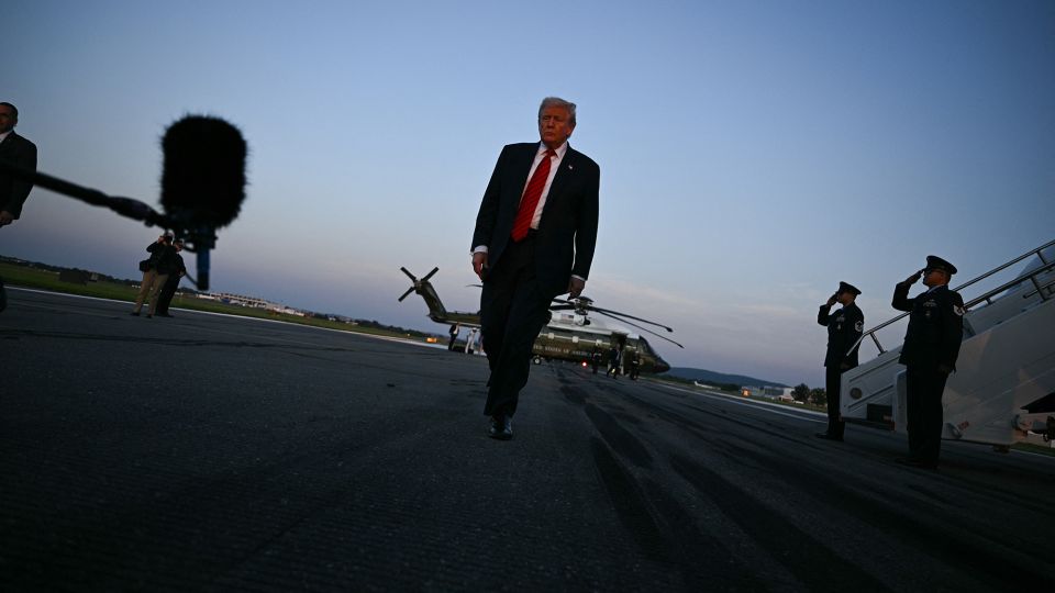 US President Donald Trump walks to speak to the media at Lehigh Valley International Airport in Allentown, Pennsylvania, on August 3, 2025 as returns to the White House from his Bedminster residence, where he spent the weekend. - Brendan Smialowski/AFP/Getty Images