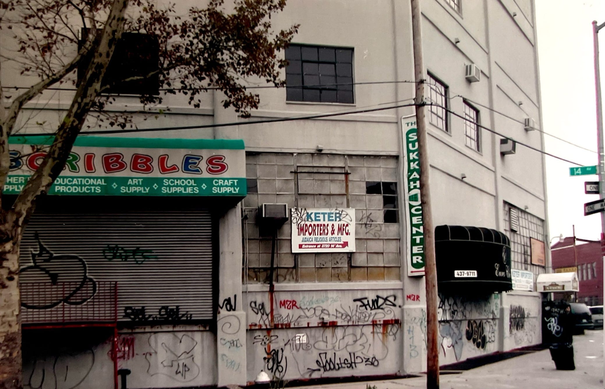 grey concrete new york city building covered in grafiti
