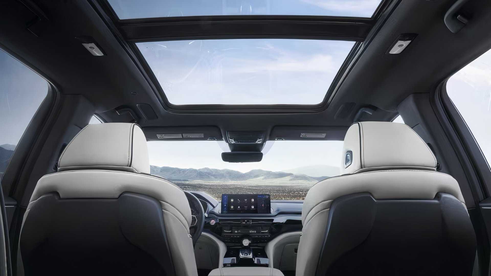 2025 Acura MDX interior showing front seats, windows, and roof