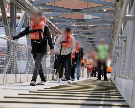 Screengrab taken from a video issued by the Home Office of the first small boat arrivals detained under the ‘one in, one out’ deal in Dover, Kent. Photograph: Home Office/PA