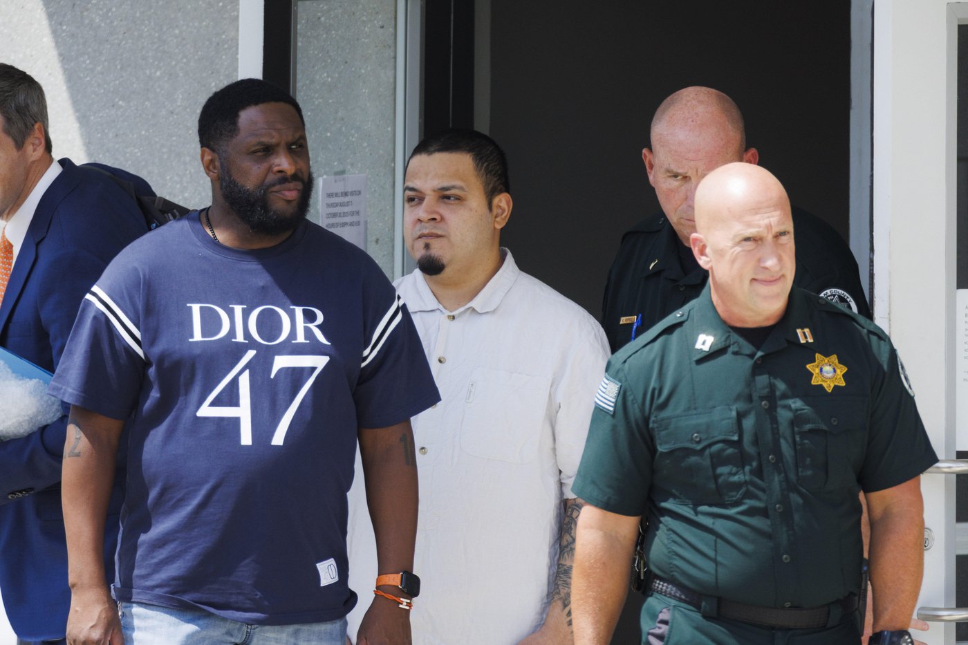 Kilmar Abrego Garcia, third from right, leaves the Putnam County Jail, Friday, Aug. 22, 2025, in Cookeville, Tenn. (AP Photo/Brett Carlsen)