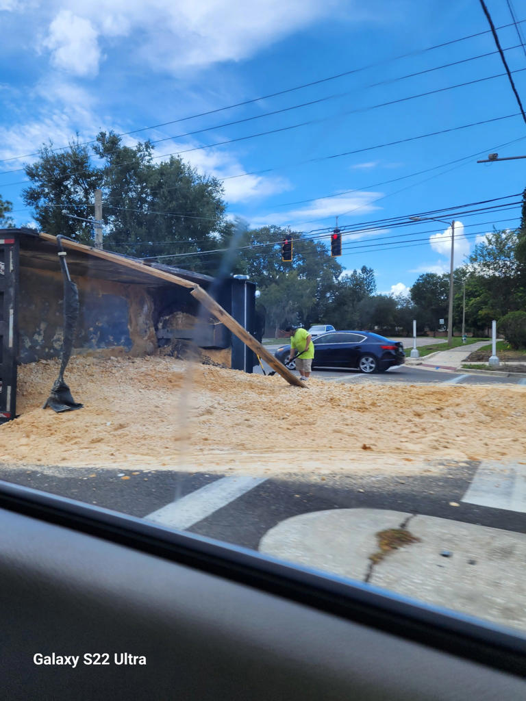 Dump truck attempting a U-turn overturns on University Boulevard in Orlando