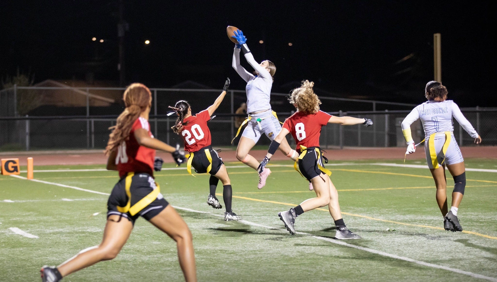 Casa Grande's Kayla Tacker (center) goes up for an interception in a game during the 2024 season. Tacker is one of The Republic's top-ranked defensive backs headed into 2025.