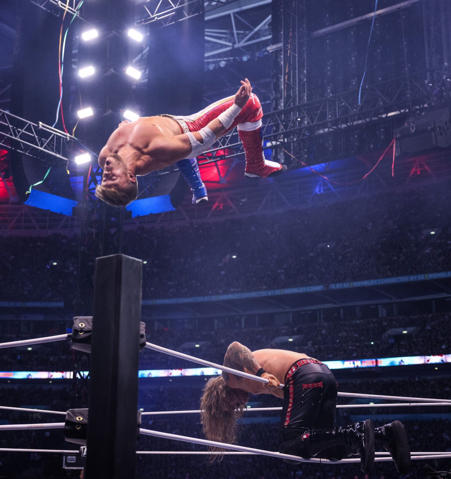 Will Ospreay hits a Shooting Star Press onto WWE legend Chris Jericho during AEW All In London at Wembley Stadium