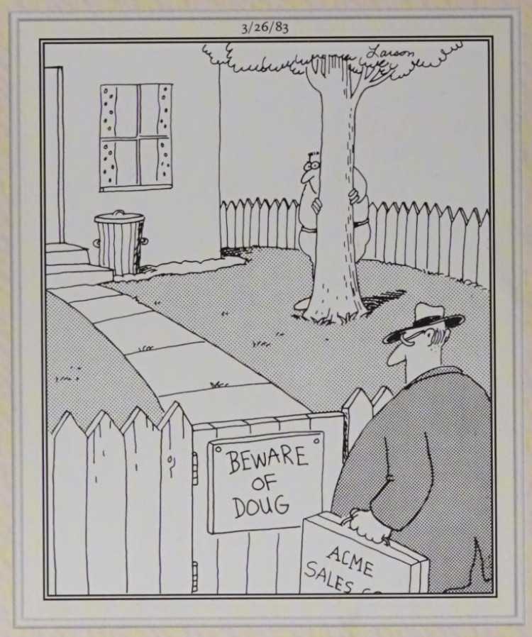 A man hiding behind a tree