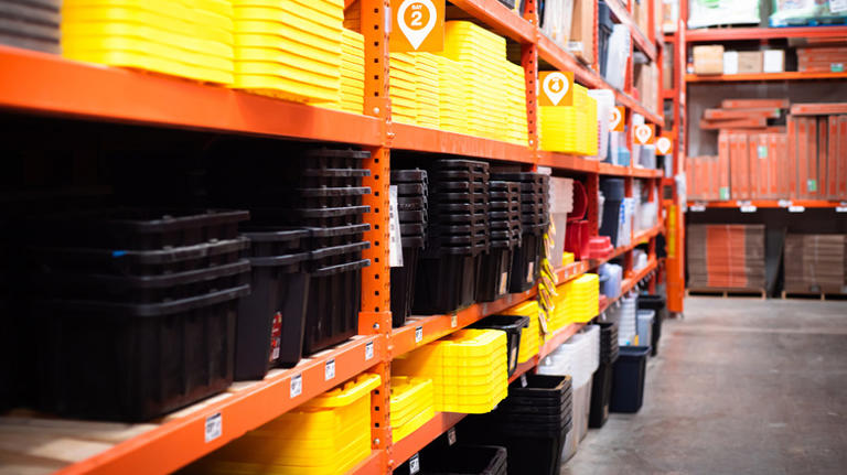 Shelves of heavy duty storage containers in a store