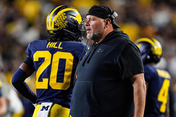Michigan defensive line coach Lou Esposito talks to players after a play against New Mexicoduring the first half at Michigan Stadium in Ann Arbor on Saturday, August 30, 2025.