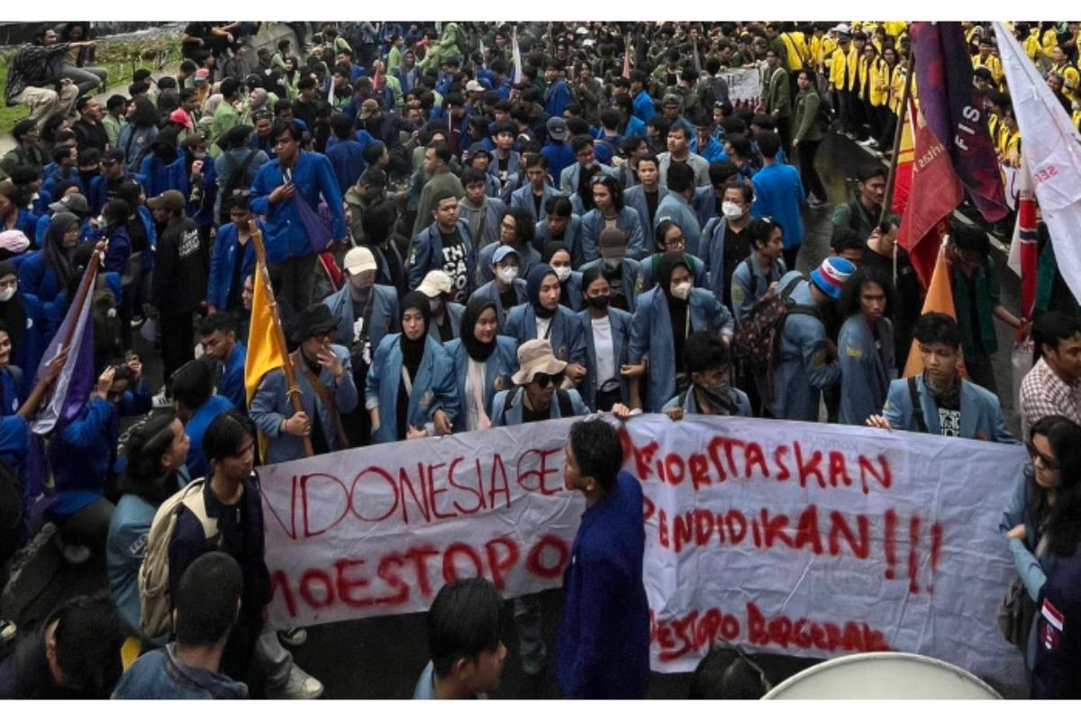 Student protesters holding signs