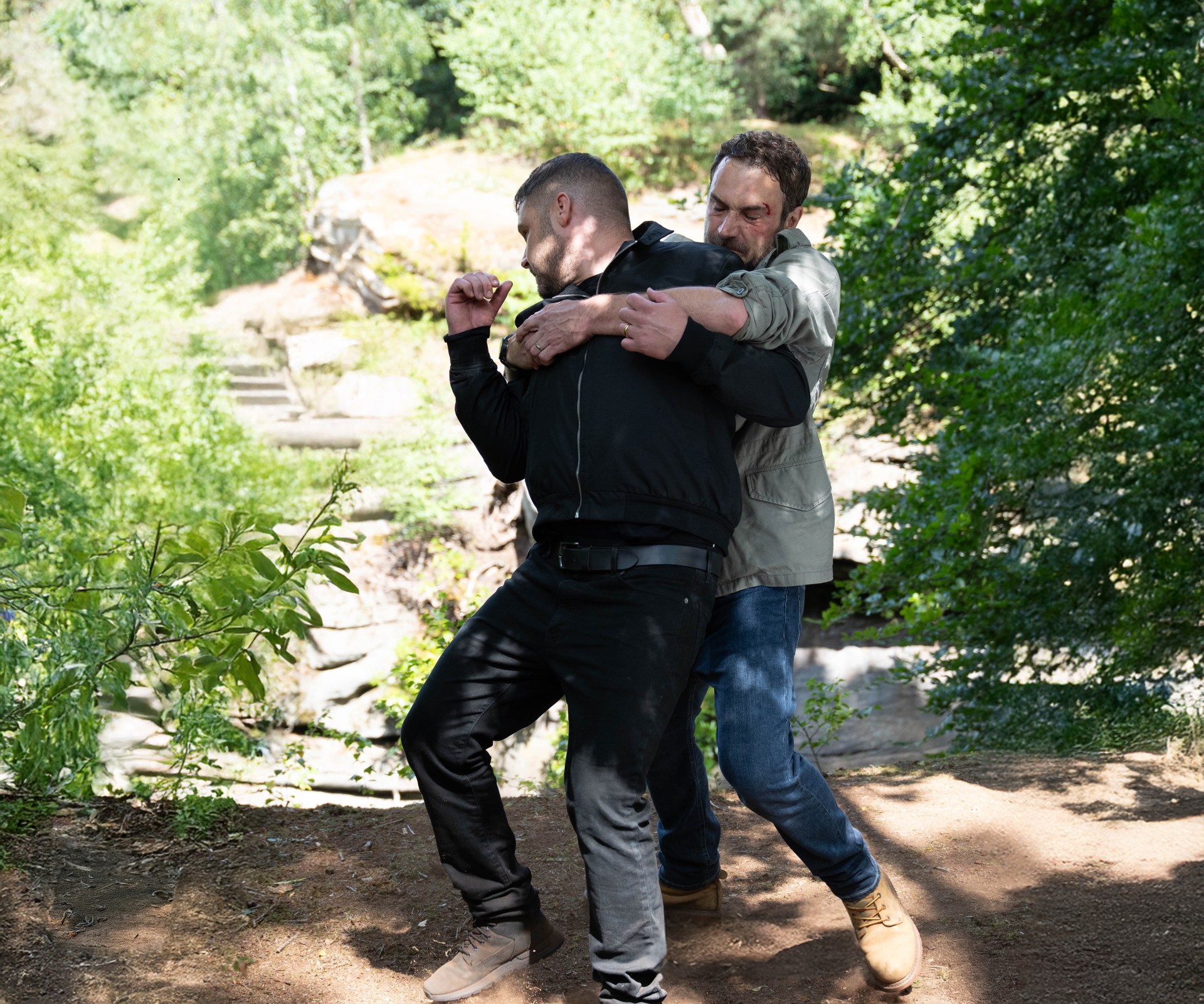 John drags Aaron over the edge of the gorge (Picture: ITV)