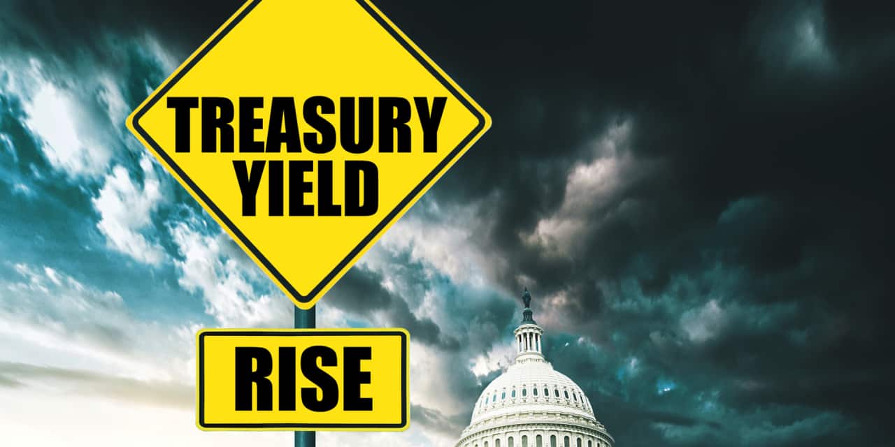 Rates are at multiyear highs, yet stocks hit fresh records. Here's how long the defiance may last.