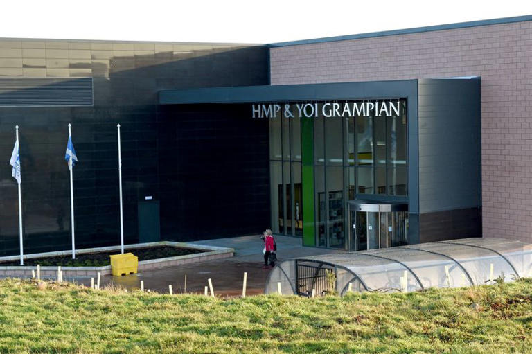 Two men in court after car found on fire outside Scots prison