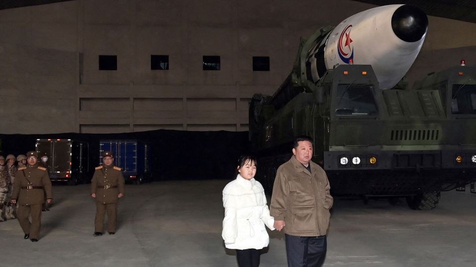 North Korean leader Kim Jong Un inspects an intercontinental ballistic missile (ICBM) with his daughter in this undated photo released on November 19, 2022. - KCNA/Reuters