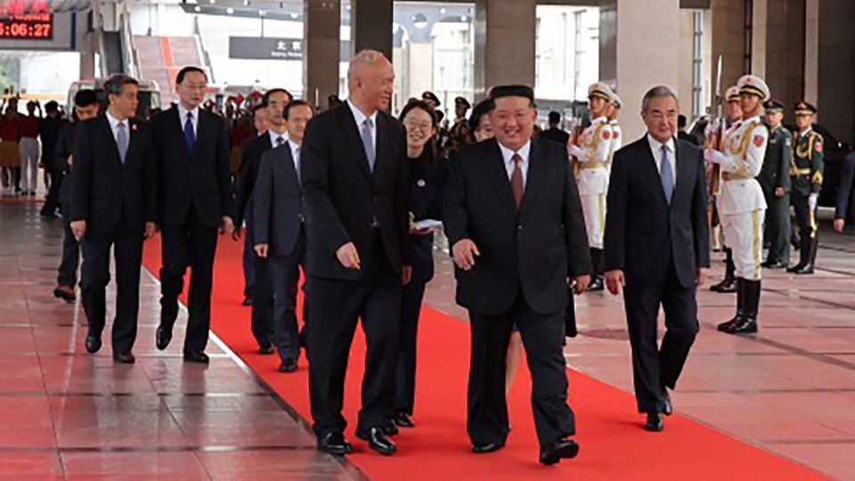 A photo released by the Korean Central News Agency (KCNA) on September 2, 2025, shows North Korean leader Kim Jong Un walking after his arrival in Beijing, China. - KCNA