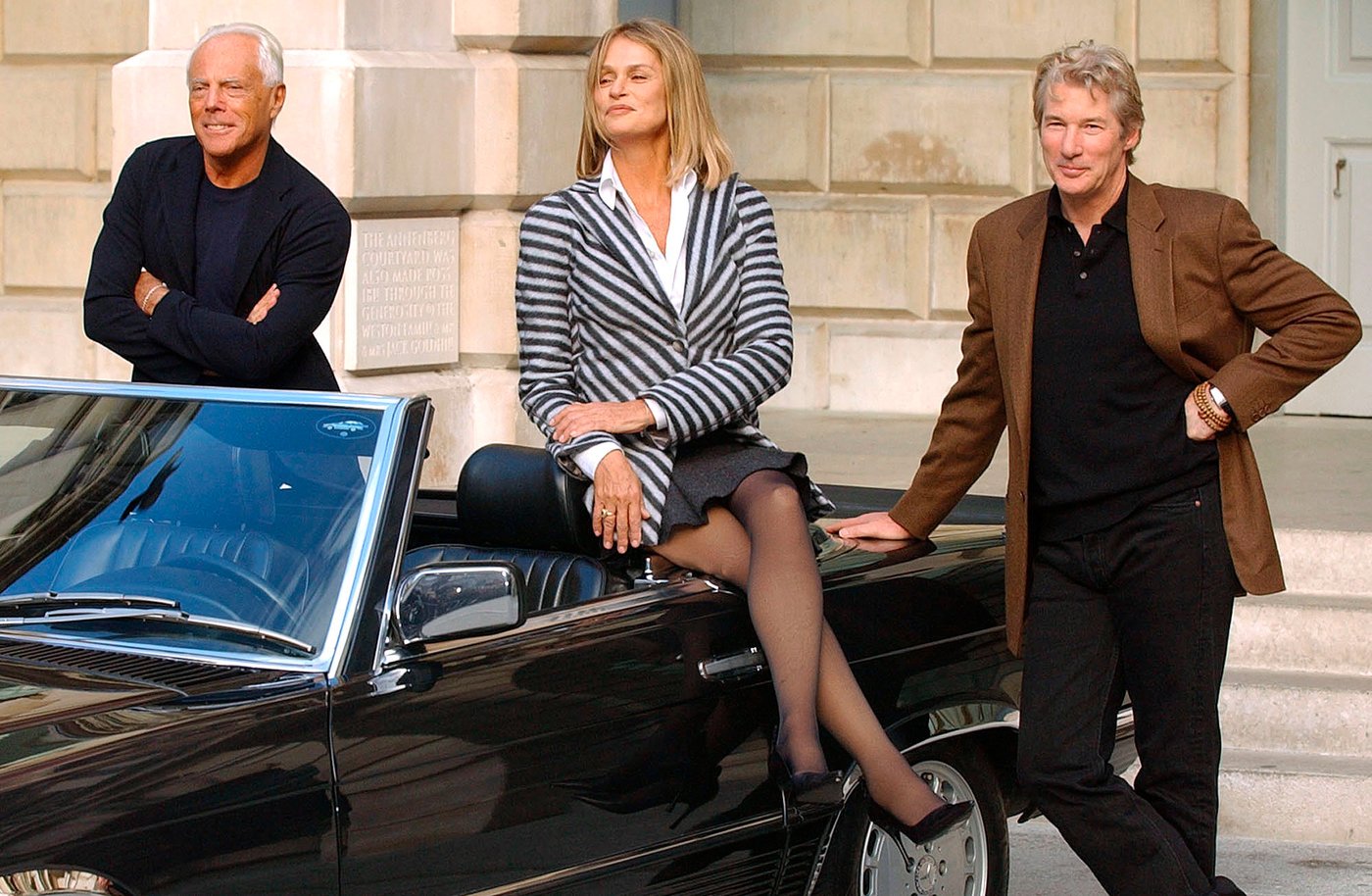FILE - American movie stars Richard Gere, right, and Lauren Hutton, center, who were both dressed in Armani clothes when they starred in the film "American Gigolo" join up with fashion designer Giorgio Armani, left, during a photocall at the Royal Academy of Arts in London, Oct. 14, 2003. (AP Photo/Richard Lewis, file)