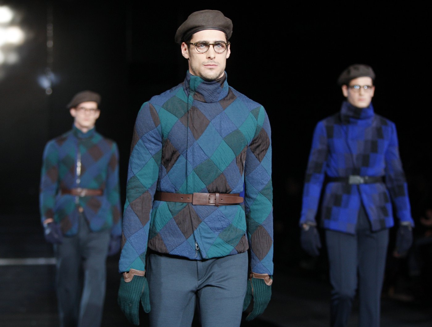 FILE - Models wear a creations of the Giorgio Armani men's Fall-Winter 2010/2011 collection, part of the Milan fashion week, unveiled in Milan, Italy, Tuesday, Jan. 19, 2010. (AP Photo/Luca Bruno, file)