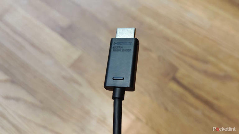 HDMI 2.1 cable over a wooden floor. 