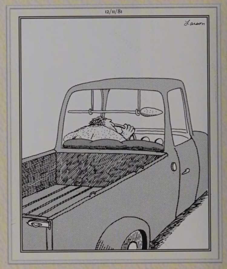 An old truck and spear holder