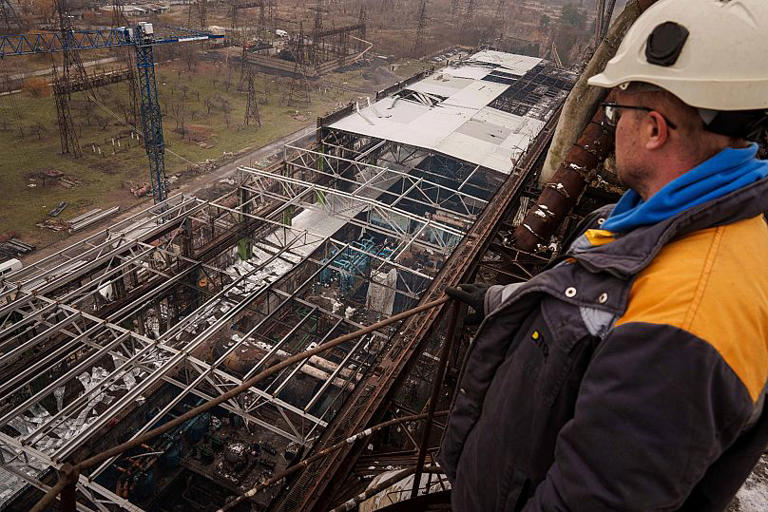 A worker looks on a production hall after a recent Russian missile attack at DTEK's power plant in Ukraine, 28 November, 2024 AP Photo