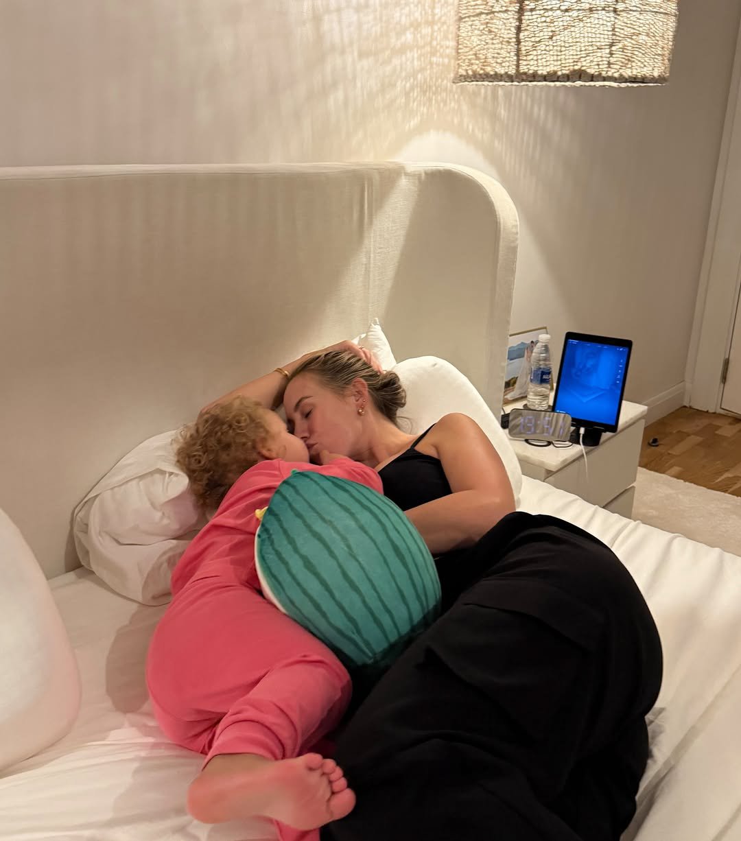 Kate Ferdinand laying in bed with her daughter Shae