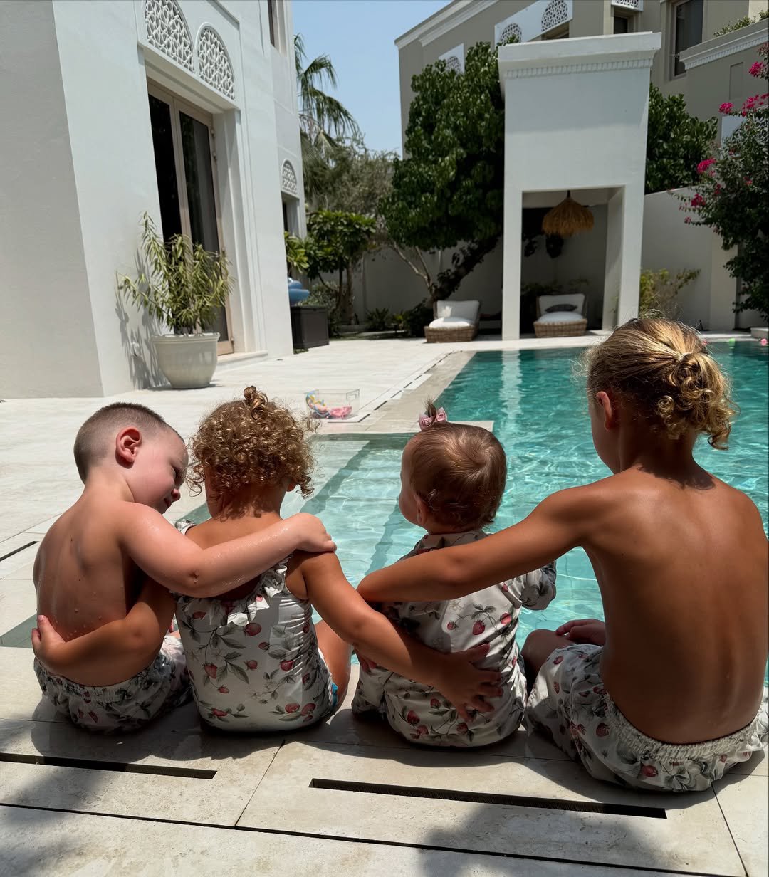 Kate and Rio Ferdinand's children sitting by the pool