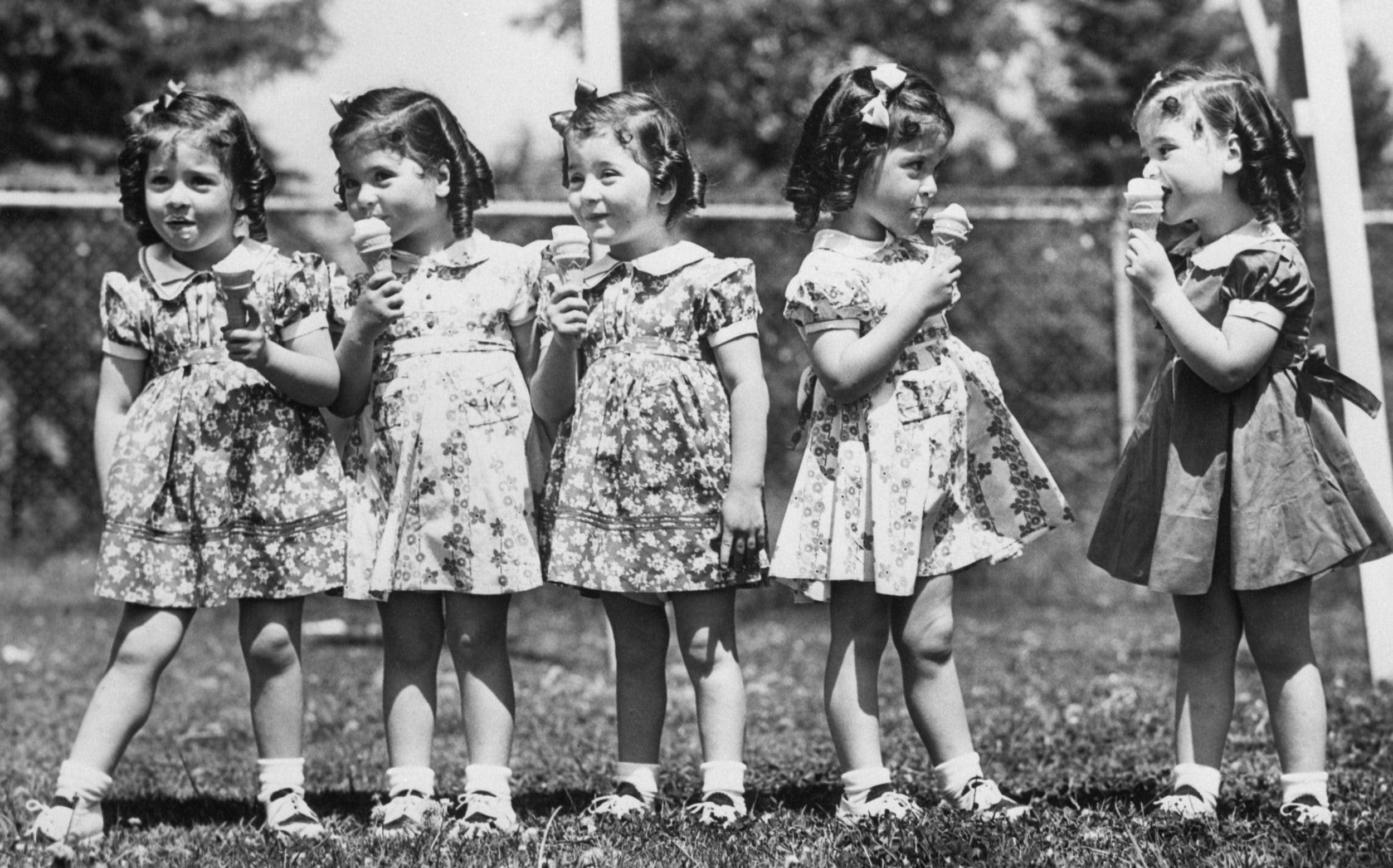 On their fourth birthday, May 28 1928, the fast-growing quintuplets received ice cream cones as a special added treat. Left to right: Emilie, Annette, Marie, Cecile and Yvonne