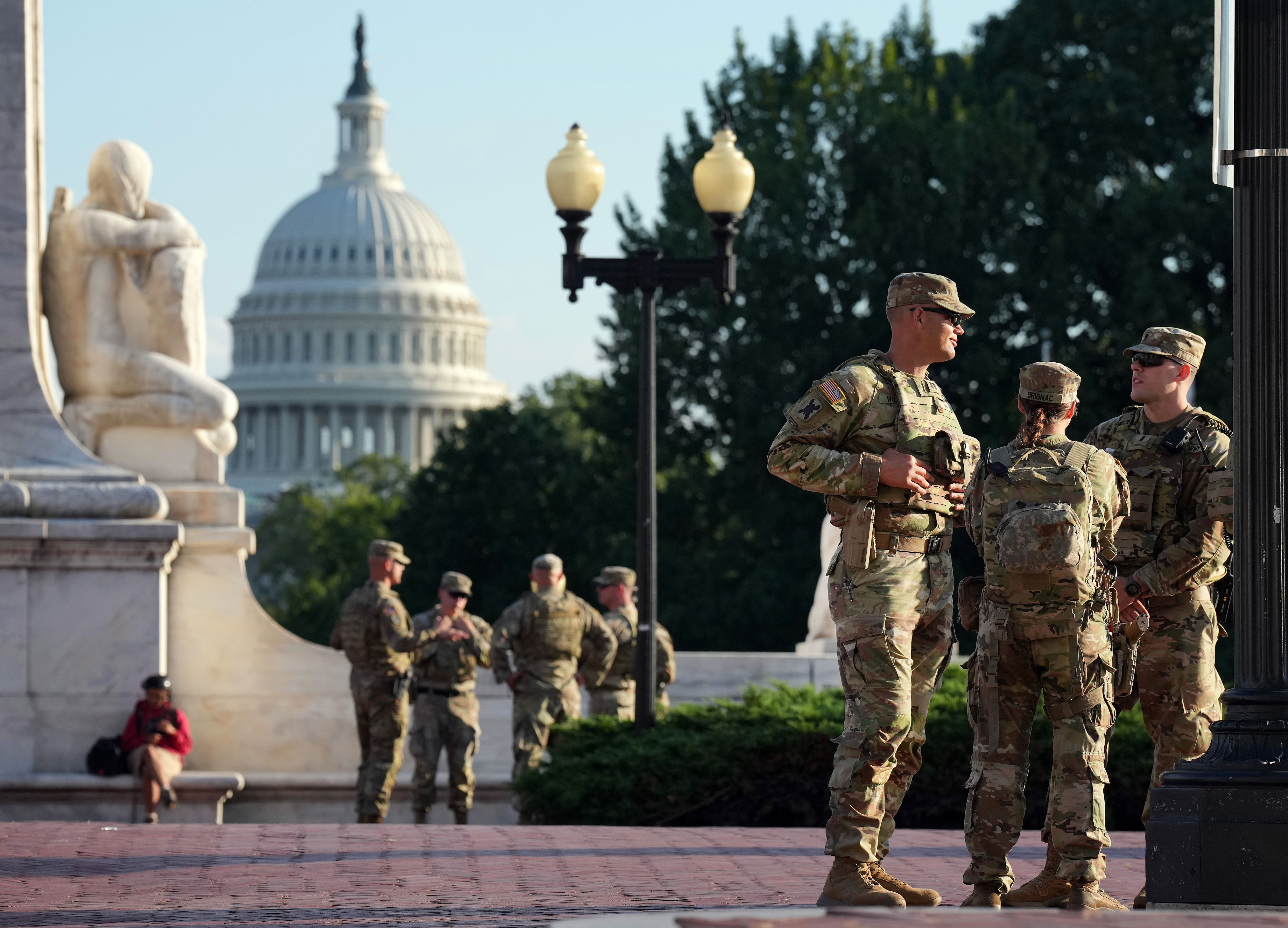 Armed National Guard troops stationed outside the White House in Washington DC on Monday (Getty)