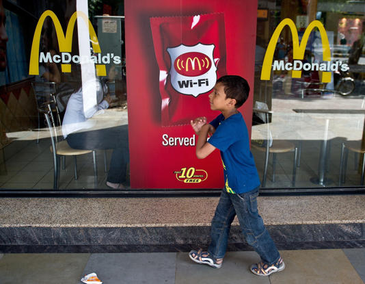 The consumption of fast foods – many of them imported from the West – has soared in recent decades - MANAN VATSYAYANA/AFP/Getty Images