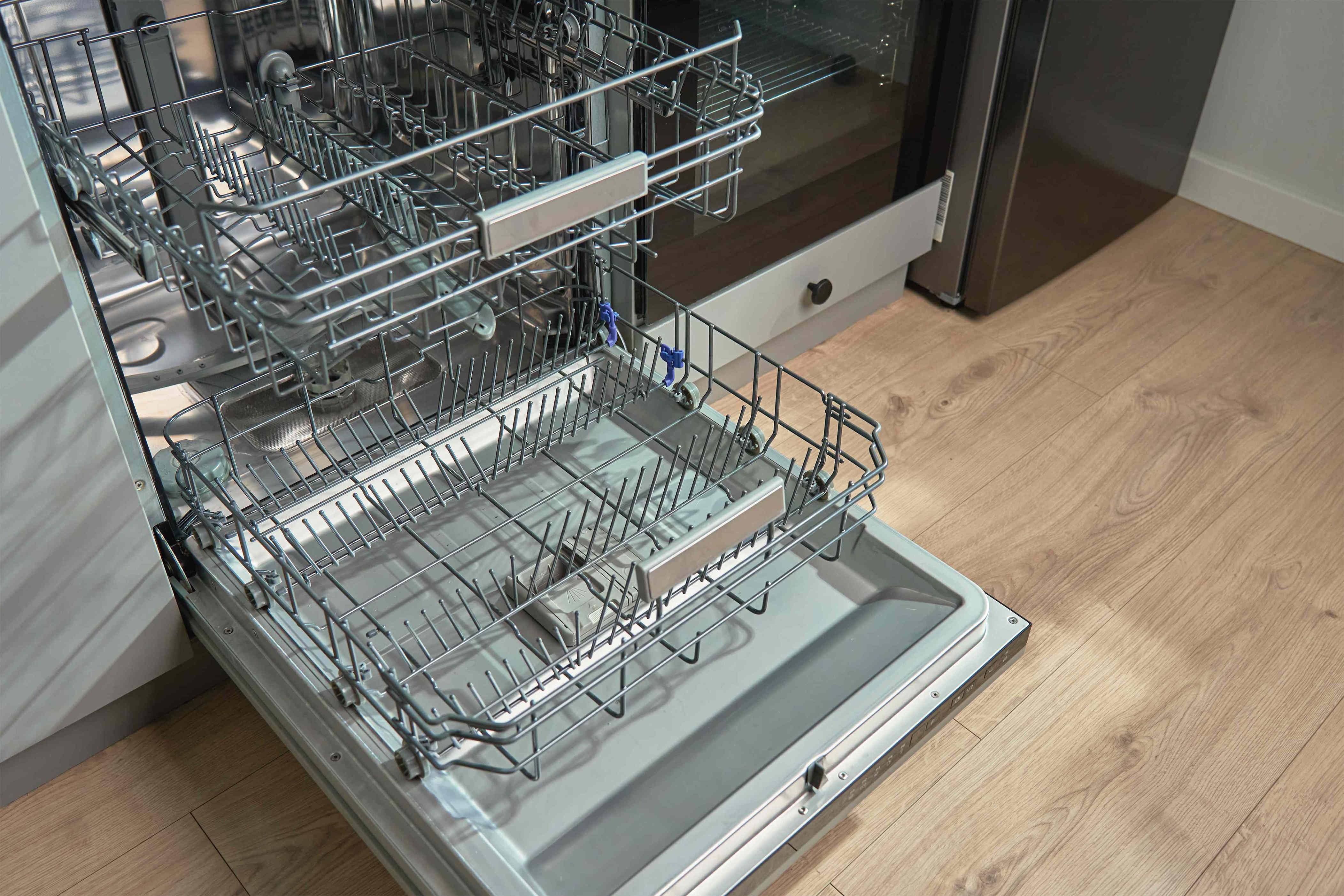 How often should you clean your dishwasher to prevent smells?