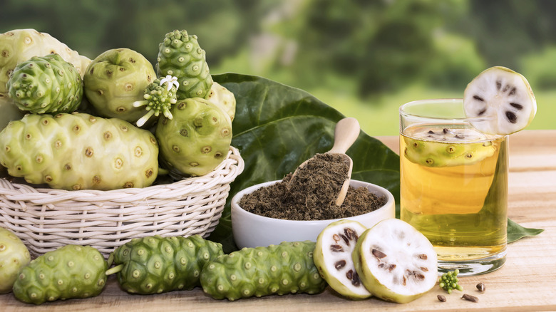 What is noni, and why is it called the vomit fruit?