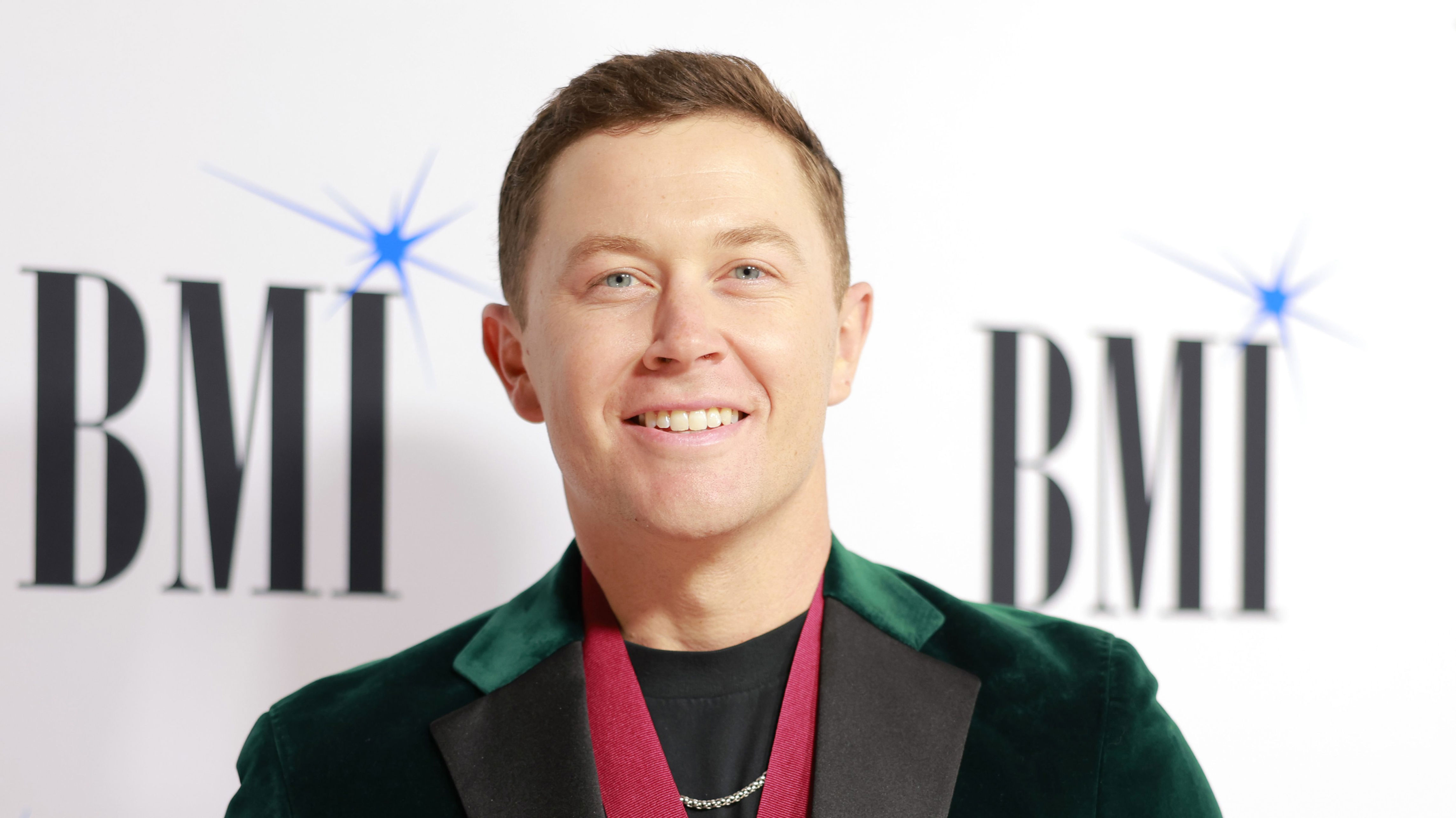 Scotty McCreery Falls on Stage During Concert, Jokes About His Tumble