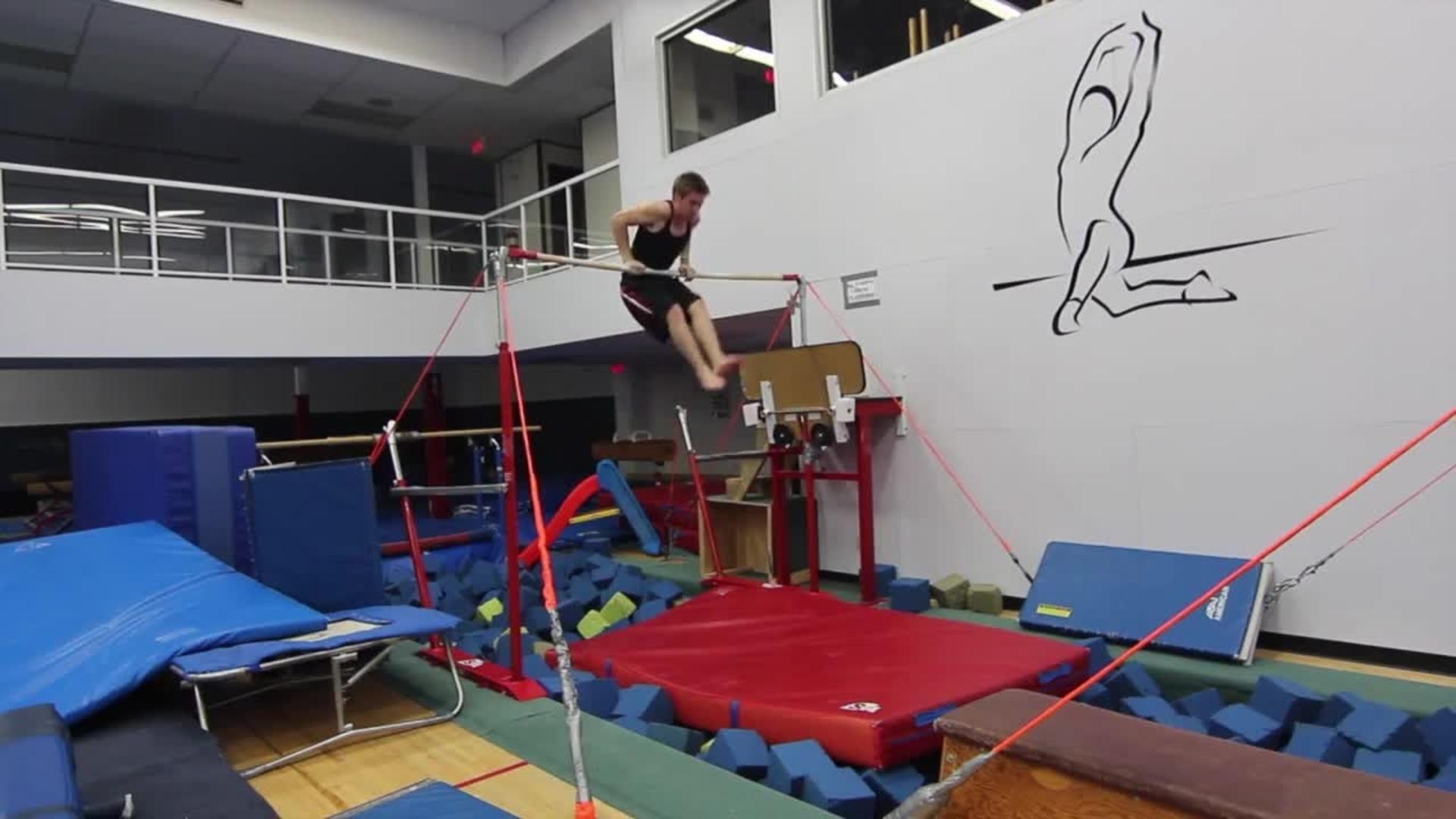 Backflipping Guy Smacks Head on High Bar