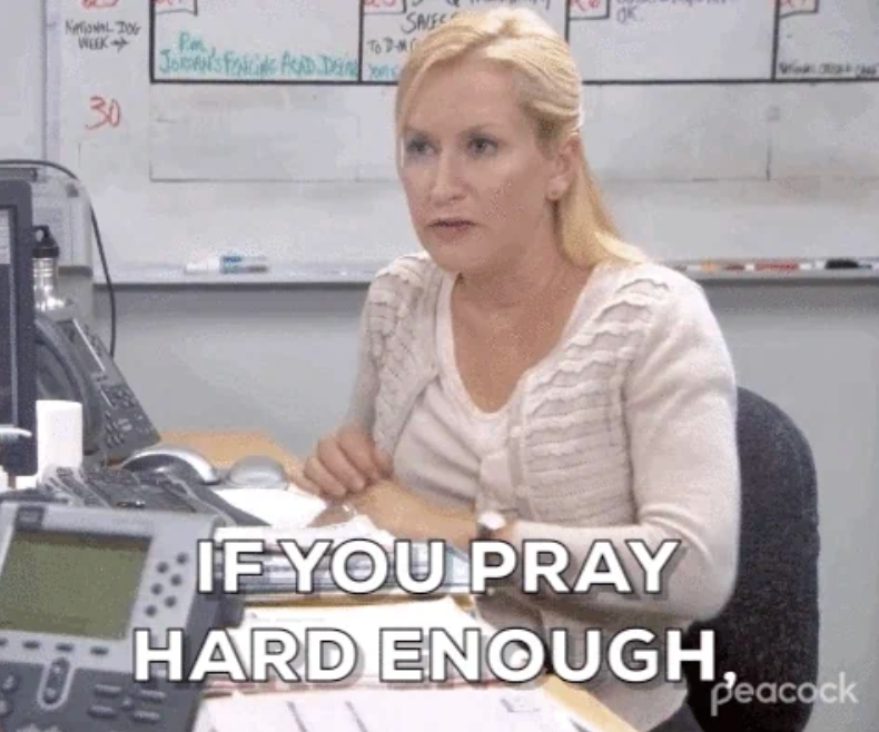 Person sitting at a desk speaks with a serious expression. Text on image: