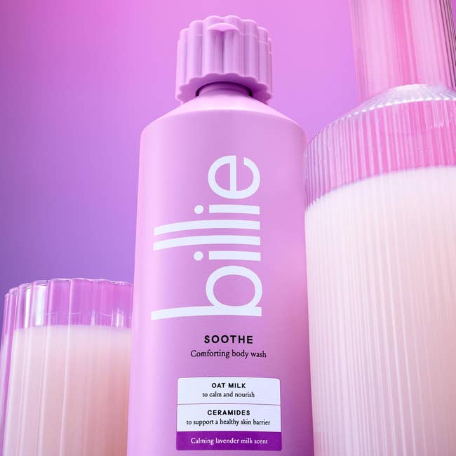 Billie Soothe body wash bottle with oat milk and ceramides, advertised as calming and nourishing for a healthy skin barrier