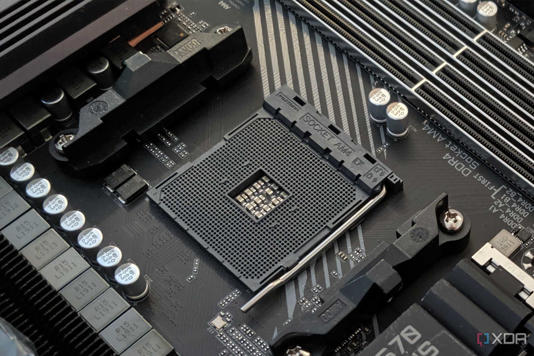 An image featuring a Gigabyte Aorus x570 Pro Wi-fi motherboard with a CPU socket on focus.
