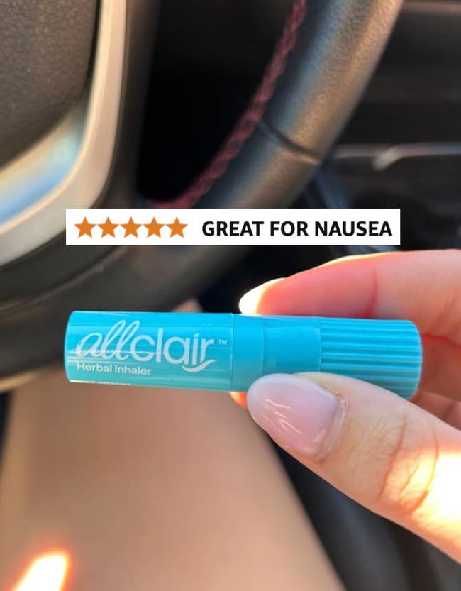 Hand holding an Allclair herbal inhaler with a 5-star rating and