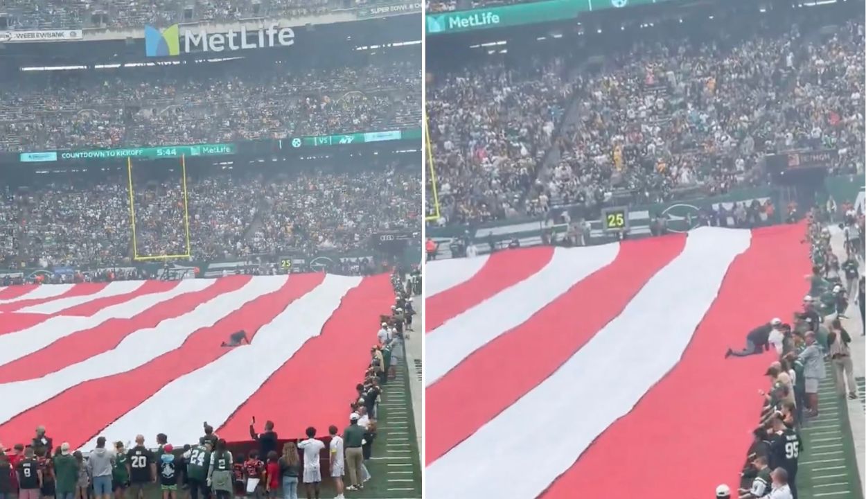 Man Gets Stuck on Giant American Flag at JetsSteelers Game Before(02)