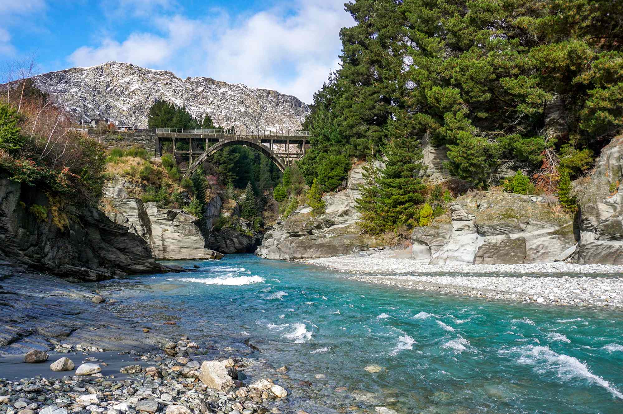 The scenic Edith Cavell Bridge over the crystal-clear Shotover Rive in Queenstown, New Zealand.