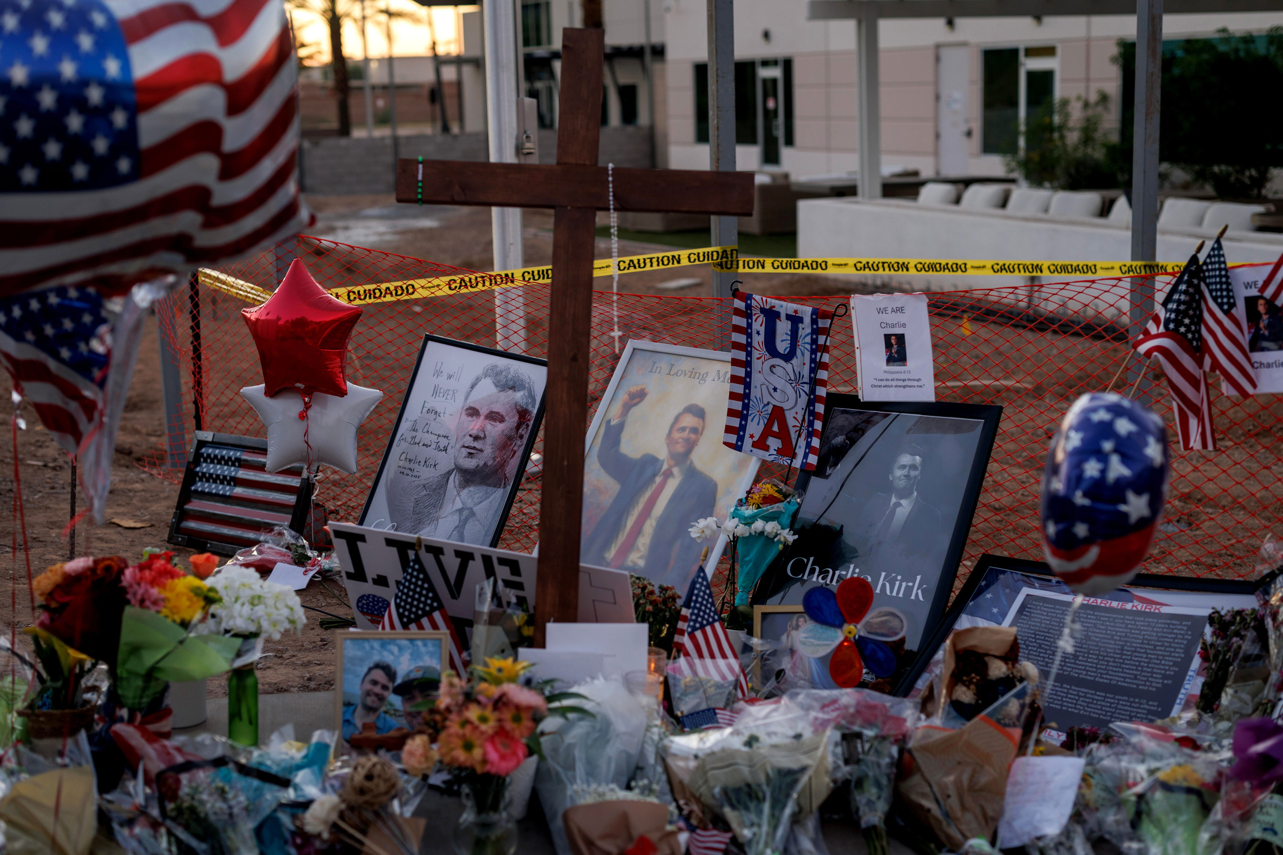 Items are left at a memorial for Charlie Kirk at the headquarters of Turning Point USA on Sept. 14, 2025 in Phoenix, Arizona. / Credit: Eric Thayer/Getty Images