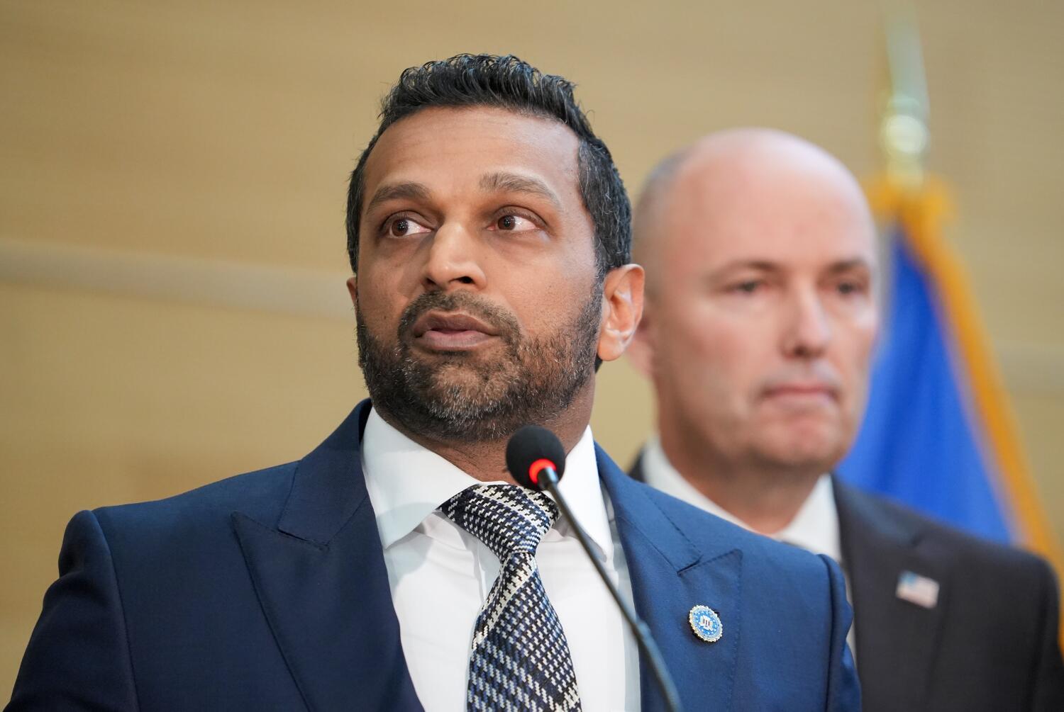 FBI Director Kash Patel makes remarks about the investigation into Charlie Kirk's slaying as Utah Gov. Spencer Cox looks on. ((Chris Samuels/The Salt Lake Tribune via Getty Images))