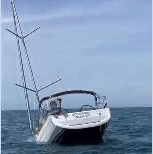 The tourist yacht sinking into the sea