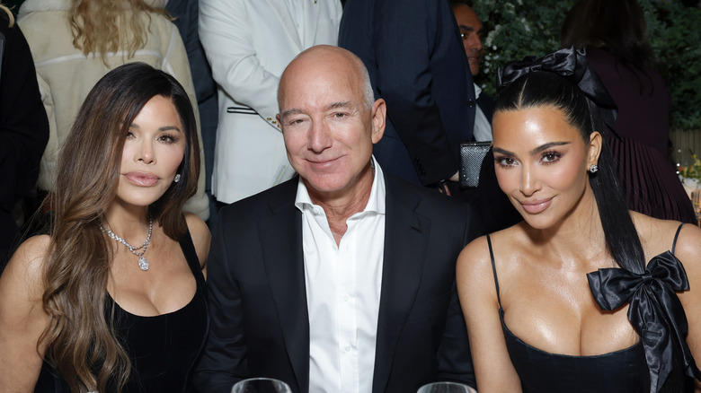 Lauren Sánchez and Jeff Bezos seated with Kim Kardashian