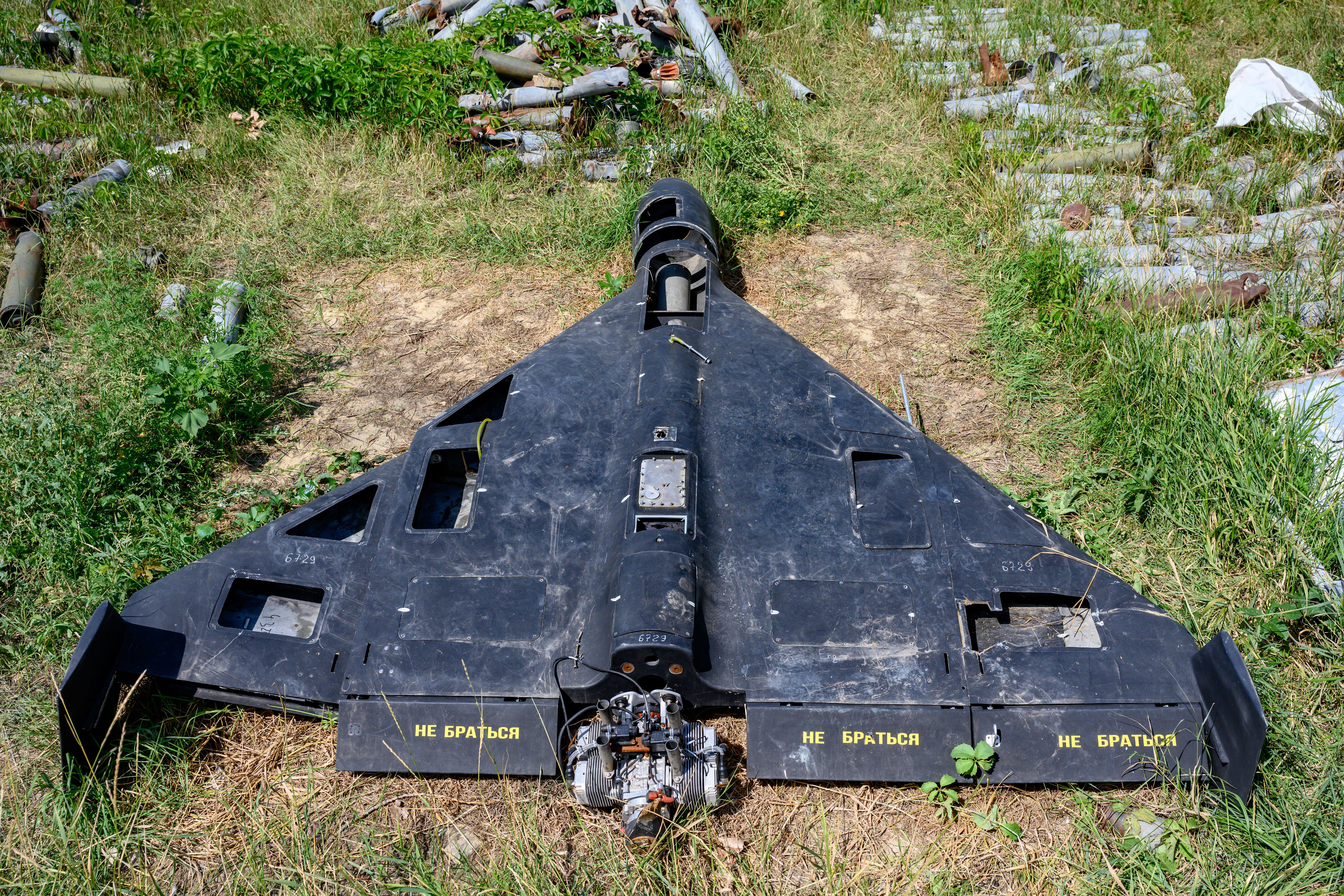 The remains of a Russian-made, Iran-designed Shahed-136 drone, known as a Geran-2 in Russia, sits among a collection of Russian drones, glide bombs, missiles and rockets launched at Ukraine maintained as evidence for eventual war crimes prosecutions against Russia, on July 30, 2025 in Kharkiv, Ukraine.