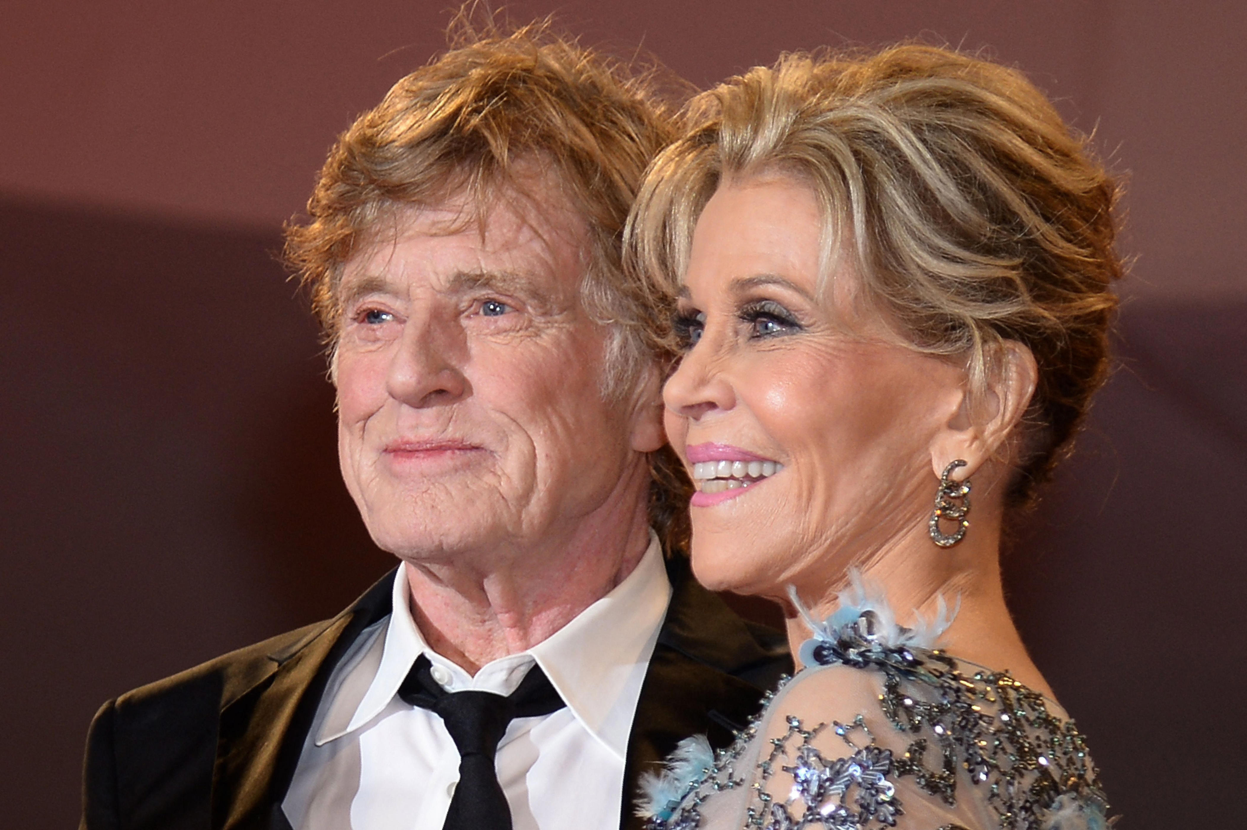 Robert Redford and Jane Fonda smile for the cameras.